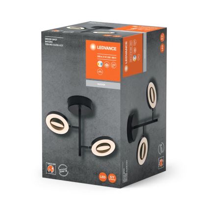 Balenie stropného svietidla LEDVANCE s tromi oválnymi svetlami. Svietidlo je čierne s teplými bielymi LED diódami. Balenie uvádza: DECOR SPOT SATURN CEILING CLICK-CCT, 2700-6500 K, LED 5Y.