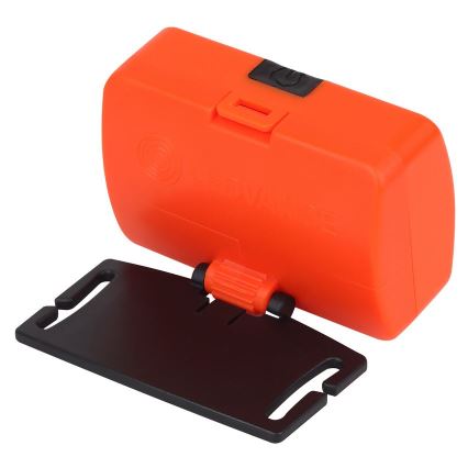 Oranžové čelové svetlo je pripevnené k čiernemu plastovému držiaku. Svetlo má vypínač.