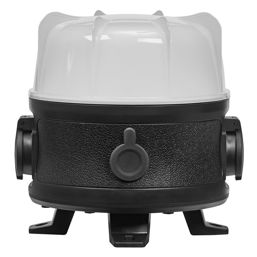 Zariadenie s bielym vrchnákom a čiernym telom stojí na troch nožičkách. Na čiernom tele je viditeľný vypínač a dva bočné konektory. Zariadenie je na bielom pozadí.