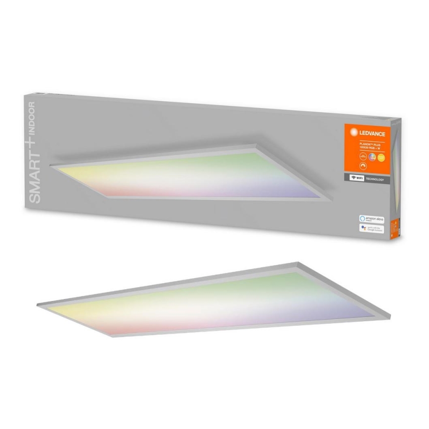 LED panel svietidlo vyžaruje farebné svetlo. Je umiestnené v balení s označením LEDVANCE, PLANON+ PLUS, SMART+ INDOOR a symbolmi WiFi a Amazon Alexa.