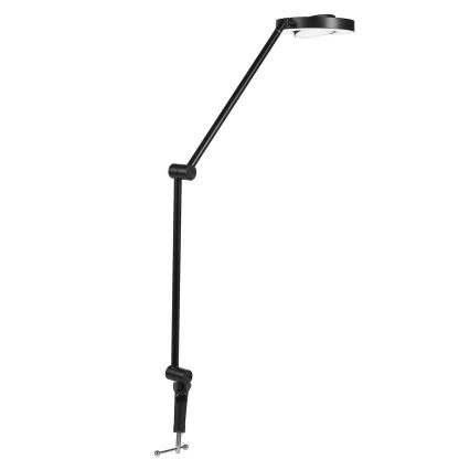 Čierna stolová lampa s dvoma ramenami sa nachádza na bielom pozadí. Lampa je pripevnená k podložke pomocou svorky. Svetlo je smerované nahor a dopredu.