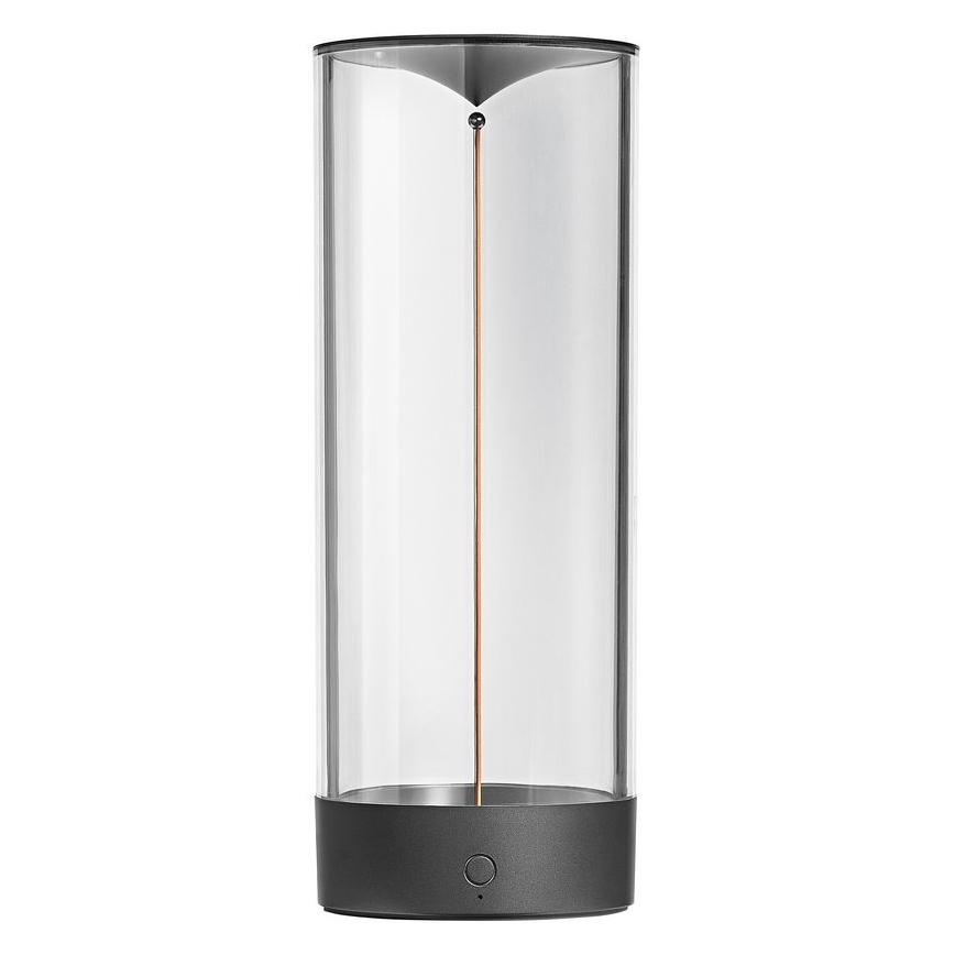 Priehľadný valcový objekt s tmavosivou základňou a vrchnákom, z ktorého klesá tenký zlatohnedý prvok. Objekt stojí na bielom pozadí.