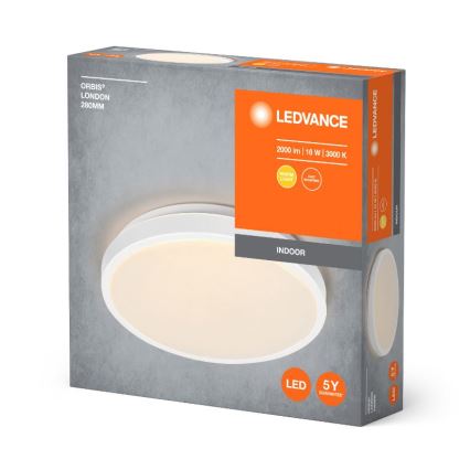Oválne LED svietidlo, osvetľuje, je zabalené v krabici s označením: ORBIS® LONDON 280MM, LEDVANCE, 2000 lm | 16 W | 3000 K, INDOOR, 5Y GUARANTEE.