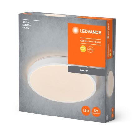 Oválny LED stropný svietidlo, osvetľujúce interiér, je zobrazené na obale. Balenie uvádza: LEDVANCE, ORBIS® LONDON 480MM, 4700 lm, 36 W, 3000 K, teplé svetlo, 5-ročná záruka.