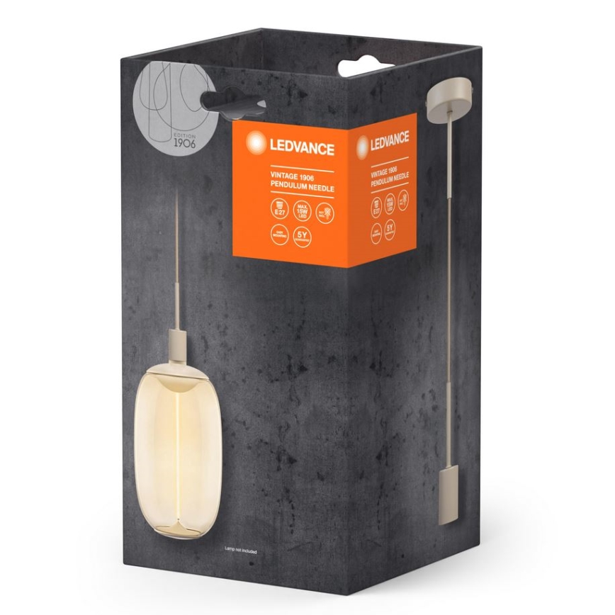 Závesné svietidlo s oválnym skleneným tienidlom je zobrazené v balení. Balenie má oranžové označenie s textom: LEDVANCE, Vintage 1906 Pendulum Needle. Na balení sú uvedené technické parametre.