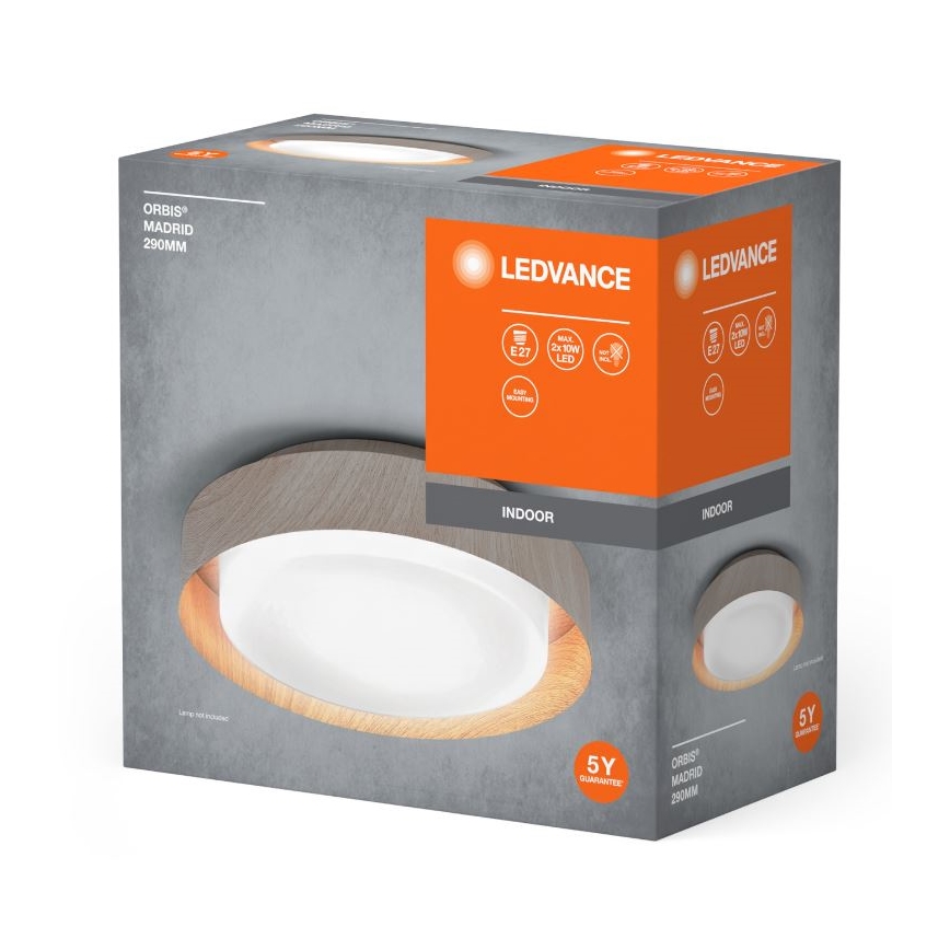 Svietidlo LEDvance Orbis Madrid 290mm je zobrazené na obale. Oválny tvar s dreveným rámom, vnútorné svetlo je biele. Balenie uvádza technické parametre: E27, 2x10W LED, vnútorné použitie, 5-ročná záruka.