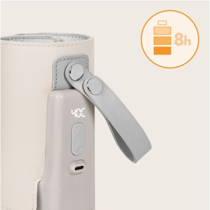 Prenositelný ohrievač fľaštičiek udržuje teplotu 40°C. Má kožený obal, popruh a zobrazuje stav batérie (8 hodín).