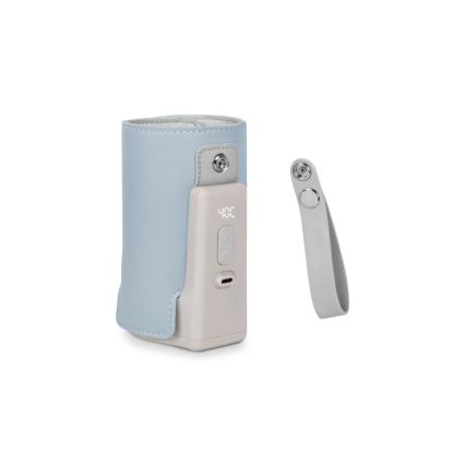 Zariadenie na meranie teploty, s modrým puzdrom a sivou základňou, s displejom zobrazujúcim „40°C“, je zobrazené vedľa odnímateľného popruhu.