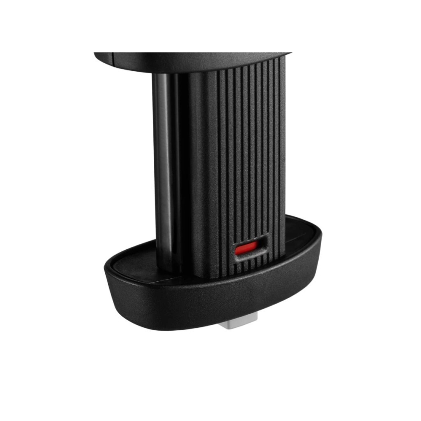 Čierny plastový držiak telefónu je prichytený k povrchu. Držiak má vertikálne drážkovanú stredovú časť a malý červený indikátor. Na spodku je viditeľný malý strieborný konektor.