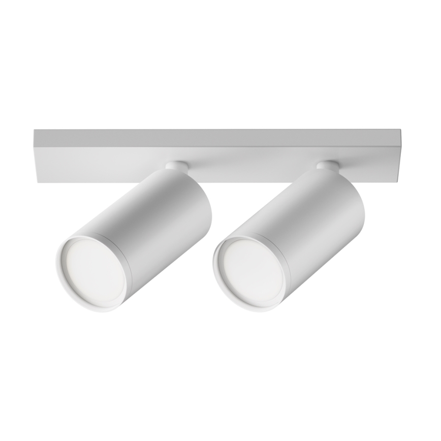 Dvojité nástenné svietidlo s valcovitými svetlami smeruje dopredu. Svietidlá sú pripevnené k obdĺžnikovej lište. Celok je bielej farby a je umiestnený na bielom pozadí.