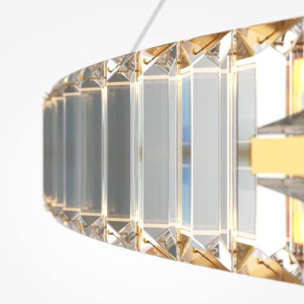 Krištáľové svietidlo v tvare polkruhu visí zhora. Je zložené z mnohých vertikálne usporiadaných hranolov, pripevnených zlatými prvkami. Svetlo prechádza cez krištáľové prvky.