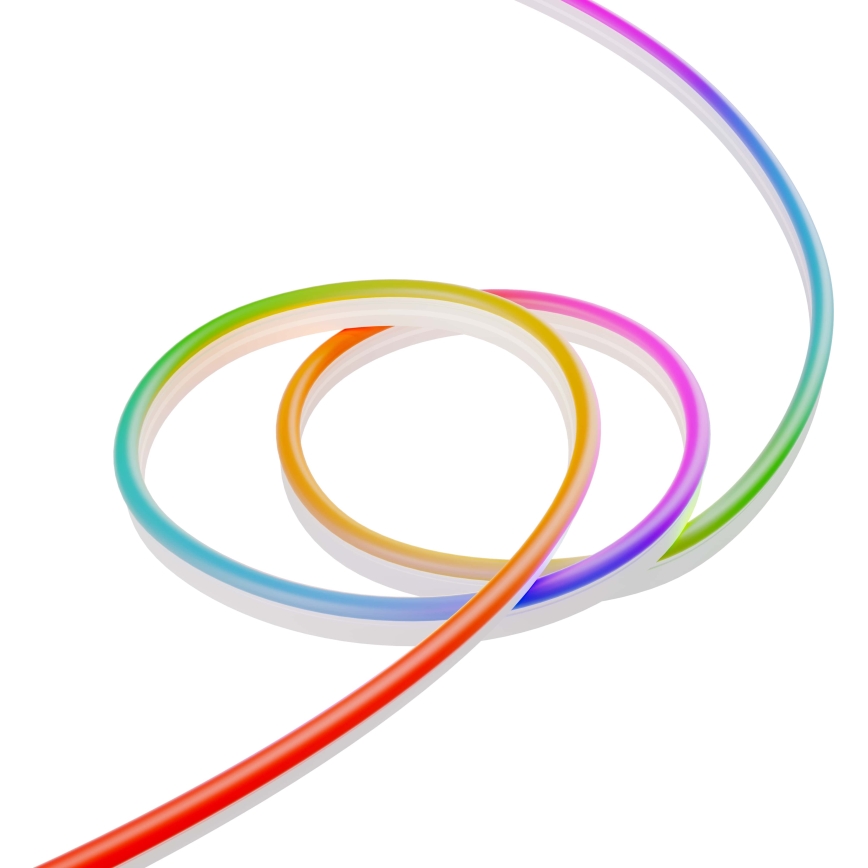 LED svetelný pás v tvare vlny osvetľuje stenu a stôl s počítačom. Na stole je klávesnica a myš. Pozadie tvorí stena s rastlinami a organizérom.