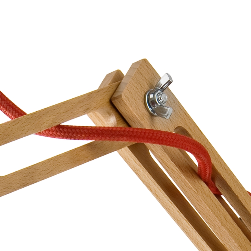 Drevená konštrukcia drží červenú šnúru. Skrutka umožňuje nastavenie uhla. Konštrukcia vyzerá ako súčasť lampy.