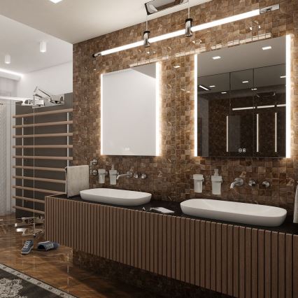 Dvojité umývadlá sú umiestnené na drevenom nábytku v kúpeľni. Steny sú obložené hnedými dlaždicami, nad umývadlami sú zrkadlá s podsvietením. V pozadí je vidieť švédska stena.