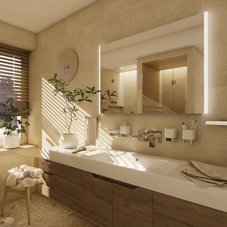 Umývadlo s batériou a doplnkami je umiestnené na drevenom nábytku v kúpeľni. Nad umývadlom je zrkadlo s LED osvetlením. V pozadí sú viditeľné žalúzie na okne a rastliny.