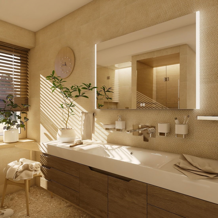Kúpeľňová umývadlová zostava s nástennou skrinkou a osvetleným zrkadlom, umiestnená v svetlej miestnosti s drevenými prvkami a rastlinami. Slnečné svetlo preniká cez žalúzie.