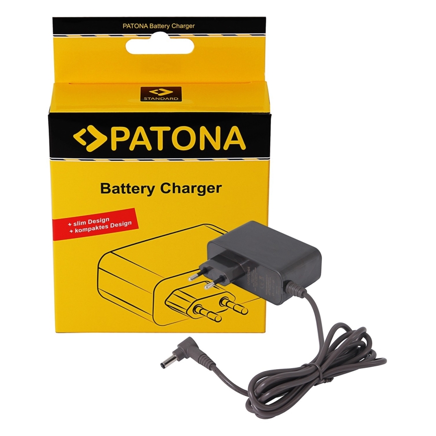 Šedá nabíjačka Patona s káblom leží vedľa žltej krabice. Na krabici je nápis „PATONA Battery Charger“, „slim Design“ a „kompaktes Design“.