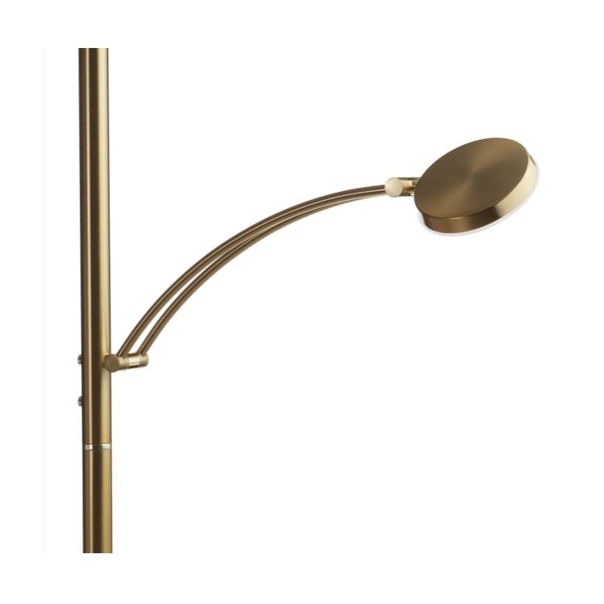 Stojacia lampa s výsuvnou ramenom a kruhovým tienidlom zlatavej farby. Lampa je pripevnená k vysokému kovovému stojanu. Svetlo smeruje doprava a mierne nahor.