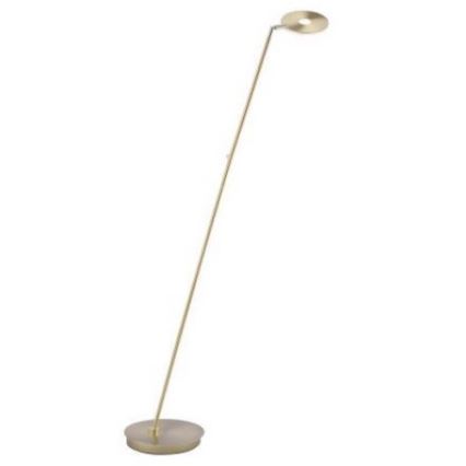Stojacia lampa s tenkou zlatou tyčou a okrúhlou hlavou svietidla stojí na kruhovej základni. Lampa osvetľuje priestor.