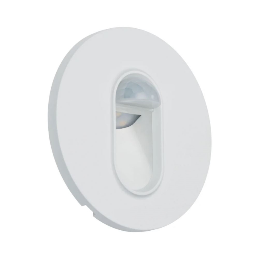 Biela kruhová nástenná lampa s integrovaným pohybovým senzorom a LED svetlom. Lampa je zapustená do steny. Svietidlo je osvetľovacie.