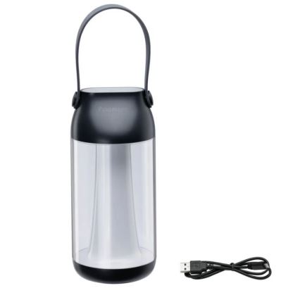Prenositelná lampa s rukoväťou svieti. Je z tmavošedej a priehľadnej plastovej časti. K lampe patrí USB kábel na nabíjanie. Na vrchnej tmavošedej časti je logo „Paulmann“.
