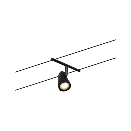 Čierna bodová lampa svieti. Je pripevnená k dvojitému systému koľajníc na strope. Lampa je smerovaná mierne nadol.
