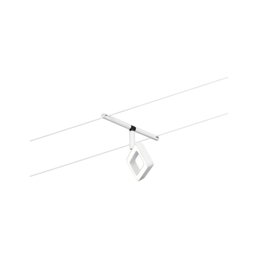 Biela štvorcová lampa visí z bielej tyče pripevnené k dvom paralelným káblom. Lampa má vnútri menší štvorcový otvor.