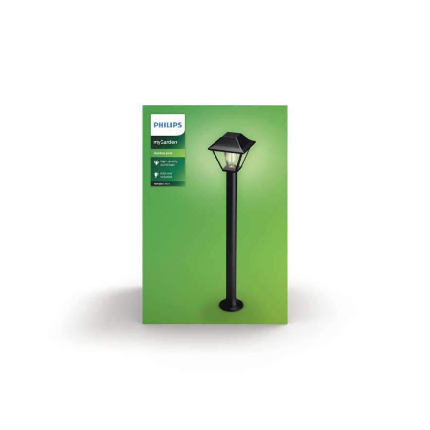 Záhradné svietidlo svieti na zelenej krabici. Krabica obsahuje označenie PHILIPS myGarden, Outdoor post, High-quality dimmer, Bulb included.
