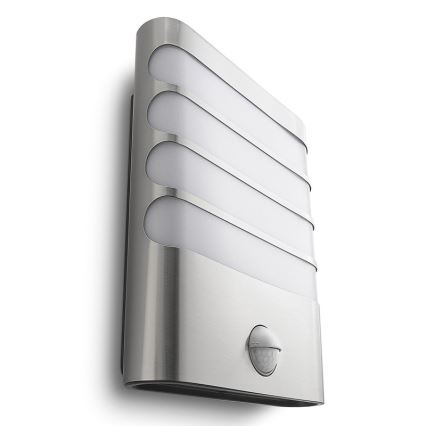 Nástenné svietidlo s pohybovým senzorom osvetľuje priestor. Svietidlo je z nehrdzavejúcej ocele, má tri horizontálne svetelné panely. Je umiestnené na stene.