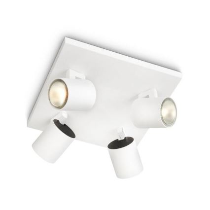 Štvorbodové stropné svietidlo s bielymi valcovými reflektormi je pripevnené k stropu. Reflektory sú otočné a vyžarujú svetlo. Svietidlo je štvorcového tvaru s bielou doskou.