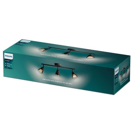 Trojramenné čierne bodové svetlo s drevenými detailmi je zobrazené na zelenej krabici Philips. Krabica obsahuje popis: Spotlight, Clear, Bulb out, Black, 3 Arm. Na krabici je uvedené: High quality lamp, designed for any light effect.