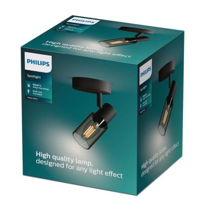 Balenie svietidla Philips Spotlight svieti. Je čierne, s priehľadnou sklenenou časťou. Na obale je uvedené: „High quality lamp, designed for any light effect“, „ClickFix easy mounting“, „Bulb not included“, „Paint: Black“.
