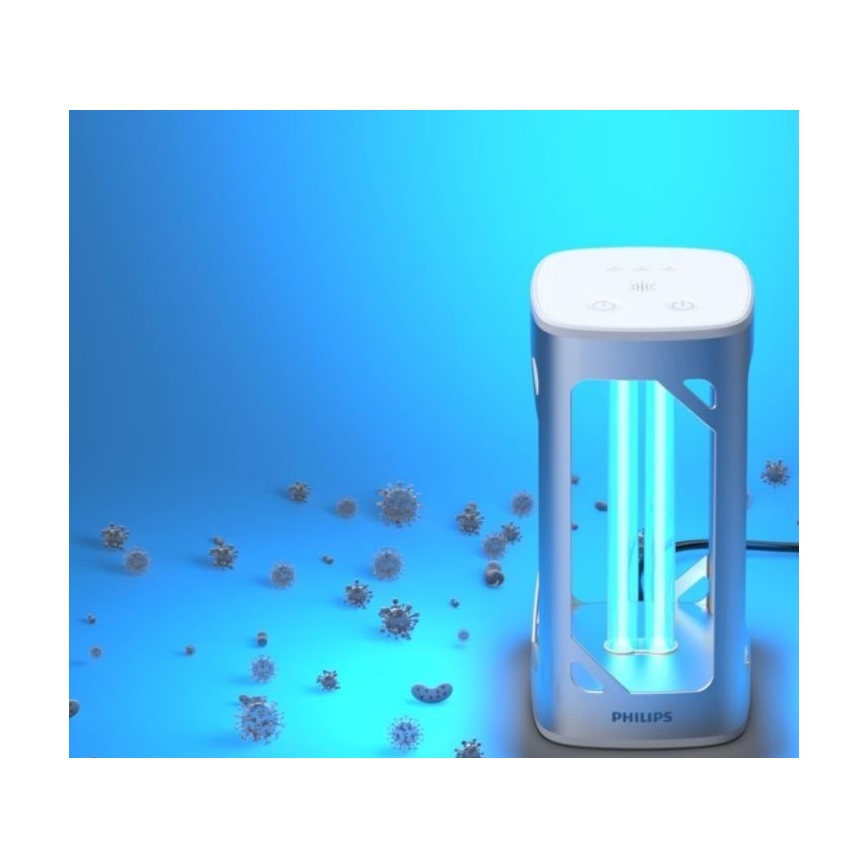 Stĺpcový UV sterilizátor Philips svieti na vírusy rozptýlené po modrom povrchu. Prístroj je strieborno-biely, má dve UV trubice.
