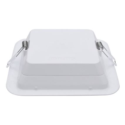 Biela štvorcová nástenná lampa Philips je zobrazená zhora. Lampa je pripevnená pomocou štyroch pružín. Viditeľný je nápis „Philips“.