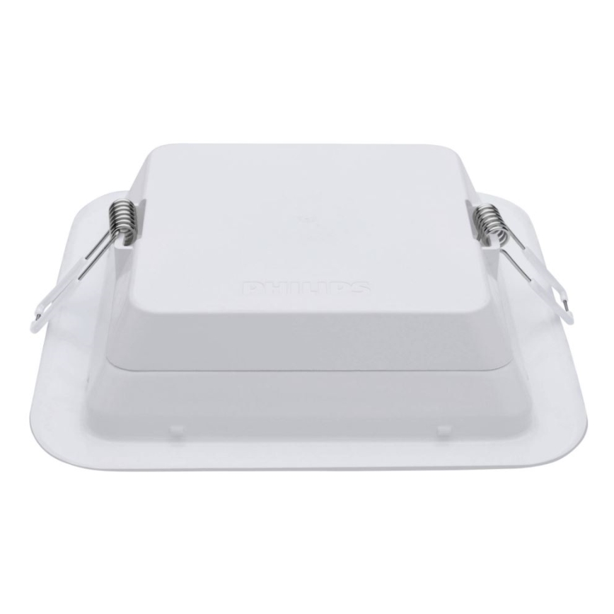 Biela štvorcová nástenná lampa Philips je zobrazená zhora. Lampa je pripevnená pomocou štyroch pružín. Viditeľný je nápis „Philips“.