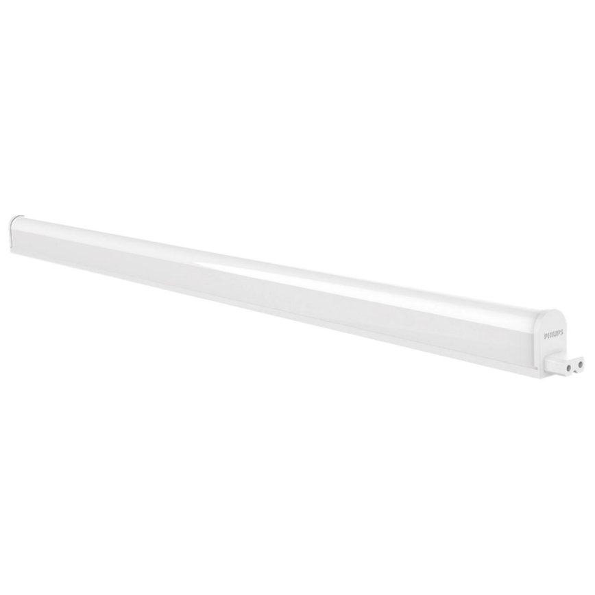 LED trubica Philips svieti. Je dlhá, biela a má na konci vidlicovú zástrčku. Je umiestnená na bielom pozadí.