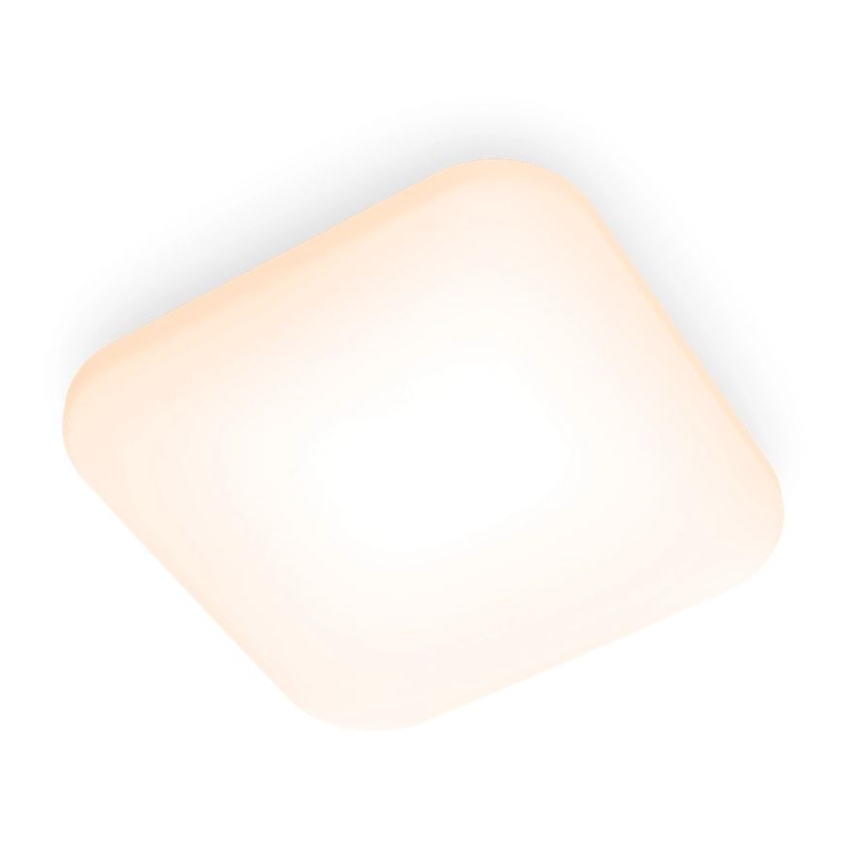 Svetlo svieti na bielom pozadí. Má štvorcový tvar so zaoblenými rohmi a jemne oranžovkasté sfarbenie. Je umiestnené na strop.