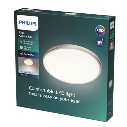 Balenie LED stropného svetla Philips zobrazuje okrúhle svetlo s rovnomerným rozložením svetla, ktoré má životnosť 20 000 hodín a technológiu EyeComfort. Balenie oznamuje pohodlné LED svetlo šetrné k očiam, s chladým bielym svetlom a sivou farbou (Twirly Grey).