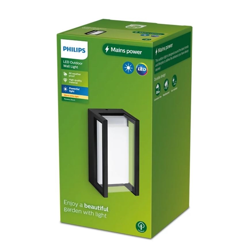 Balenie vonkajšieho LED nástenného svietidla Philips. Svietidlo je čierne, obdĺžnikové s bielym difúzorom. Balenie je zelené s popisom: LED Outdoor Wall Light, Mains power, All weather proof, High quality, Powerful light, Durable design. Nápis na spodku: Enjoy a beautiful garden with light.