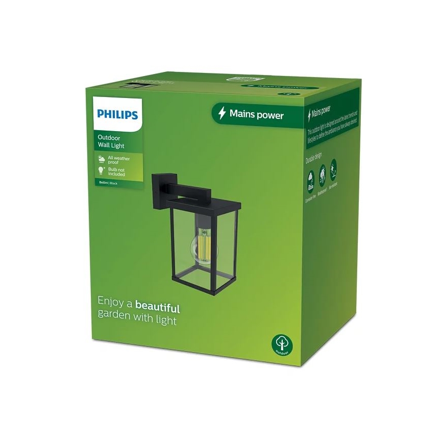 Vonkajšie nástenné svietidlo Philips je zobrazené v obale. Svietidlo je čierne, obdĺžnikové, so sklenenými stenami. Balenie je zelené, s popisom: Outdoor Wall Light, All weather proof, Bulb not included, Mains power a Enjoy a beautiful garden with light.