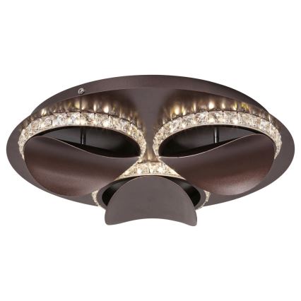Svietidlo svieti. Je bronzovo-hnedé, okrúhle, s tromi výstupkami a lemované kryštálikmi. Upevnenie na strop.