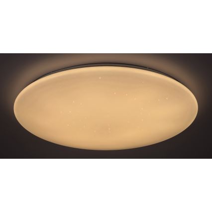 Okrúhle stropné LED svietidlo svieti teplým svetlom s drobnými bodovými svetlami, ktoré imitujú hviezdy. Je umiestnené na tmavom pozadí.