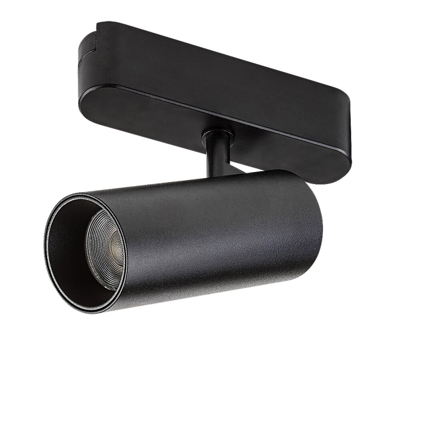 Svietidlo svieti. Je čierne, valcovitého tvaru, pripevnené k obdĺžnikovému držiaku. Biele pozadie.