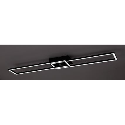 Stropné svietidlo s dvoma rovnobežnými obdĺžnikovými rámami, pričom jeden je menší a prekrýva sa s väčším. Svietidlo je čierne s bielym LED osvetlením, pripevnené k stropu.