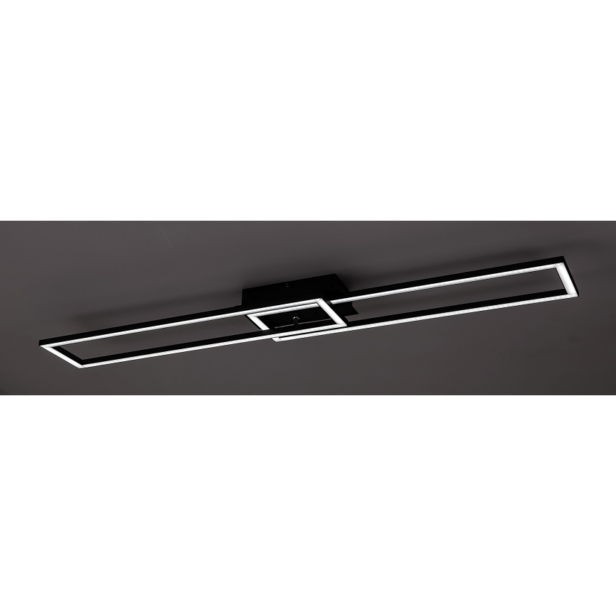 Stropné svietidlo s dvoma rovnobežnými obdĺžnikovými rámami, pričom jeden je menší a prekrýva sa s väčším. Svietidlo je čierne s bielym LED osvetlením, pripevnené k stropu.