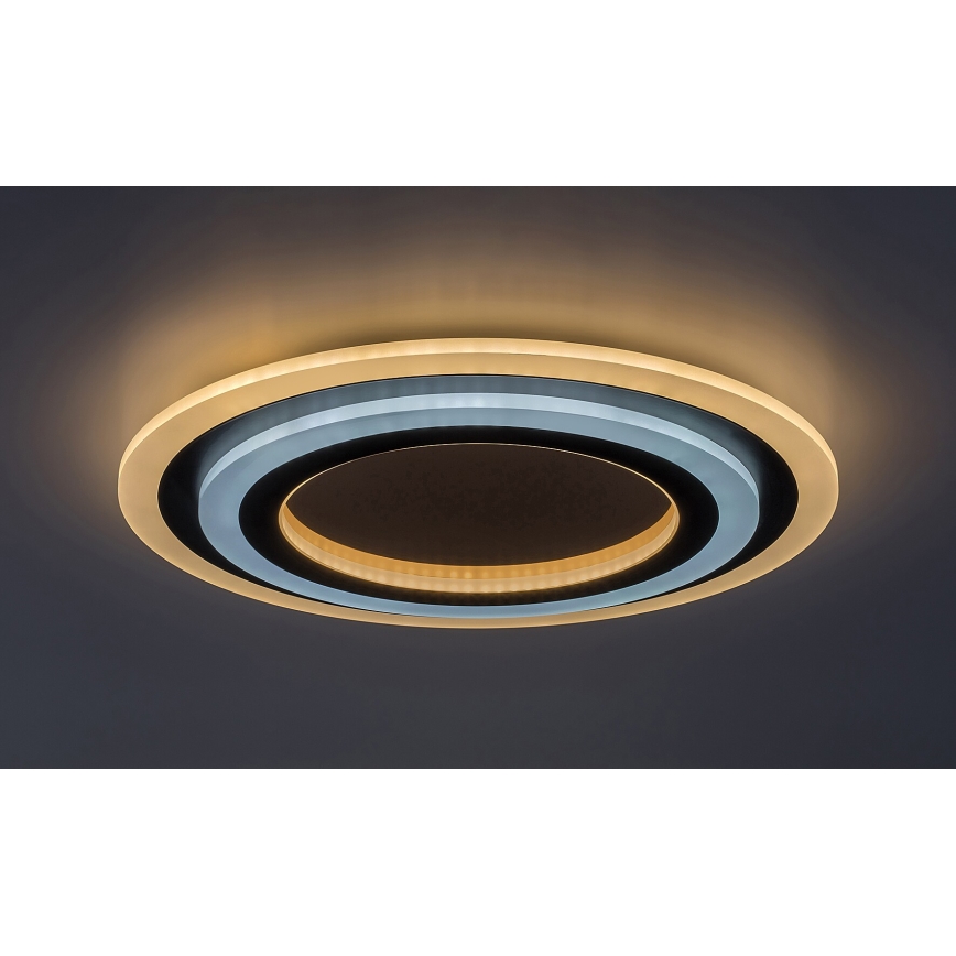 Svetlo svieti na strope. Je okrúhle a viacvrstvové, s vonkajším okrajom svetložltej farby a vnútorným tmavosivým. Vnútorný okruh svieti teplým svetlom. Celok je namontovaný na tmavosivom strope.