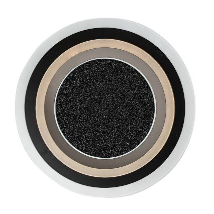 Okrúhly predmet s koncentrickými kruhmi v odtieňoch sivej, béžovej a čiernej. Stred tvorí tmavosivá, zrnitá plocha. Predmet je umiestnený na bielom pozadí.