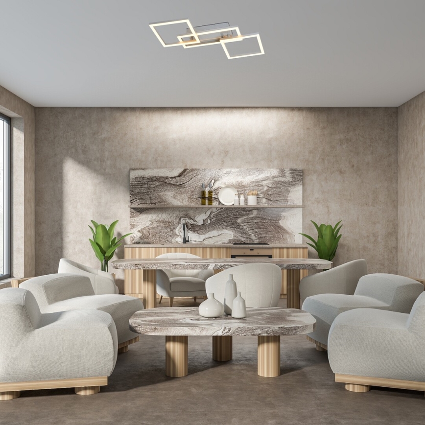 Svetlošedá pohovka je umiestnená v otvorenej miestnosti s kuchynským kútom. Kuchyňa má mramorovú stenu a drevené skrinky. Strop zdobí moderné stropné svietidlo z geometrických tvarov.