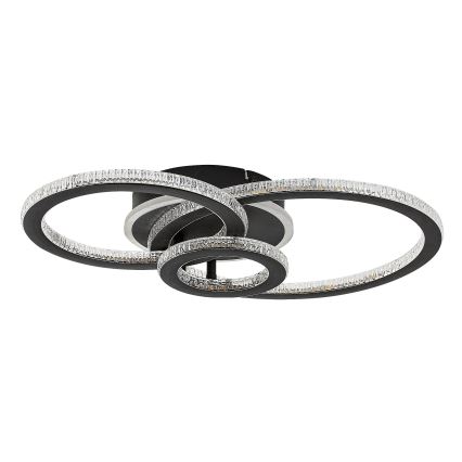Svietidlo s prepletenými kruhmi osvetľuje priestor. Kruhy sú lemované kryštálmi. Stropné svietidlo je v čiernej farbe.