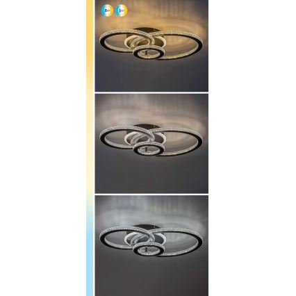 Svietidlo s tromi prepletenými kruhmi, osadenými kryštálikmi, svieti v troch farebných teplotách na strope.